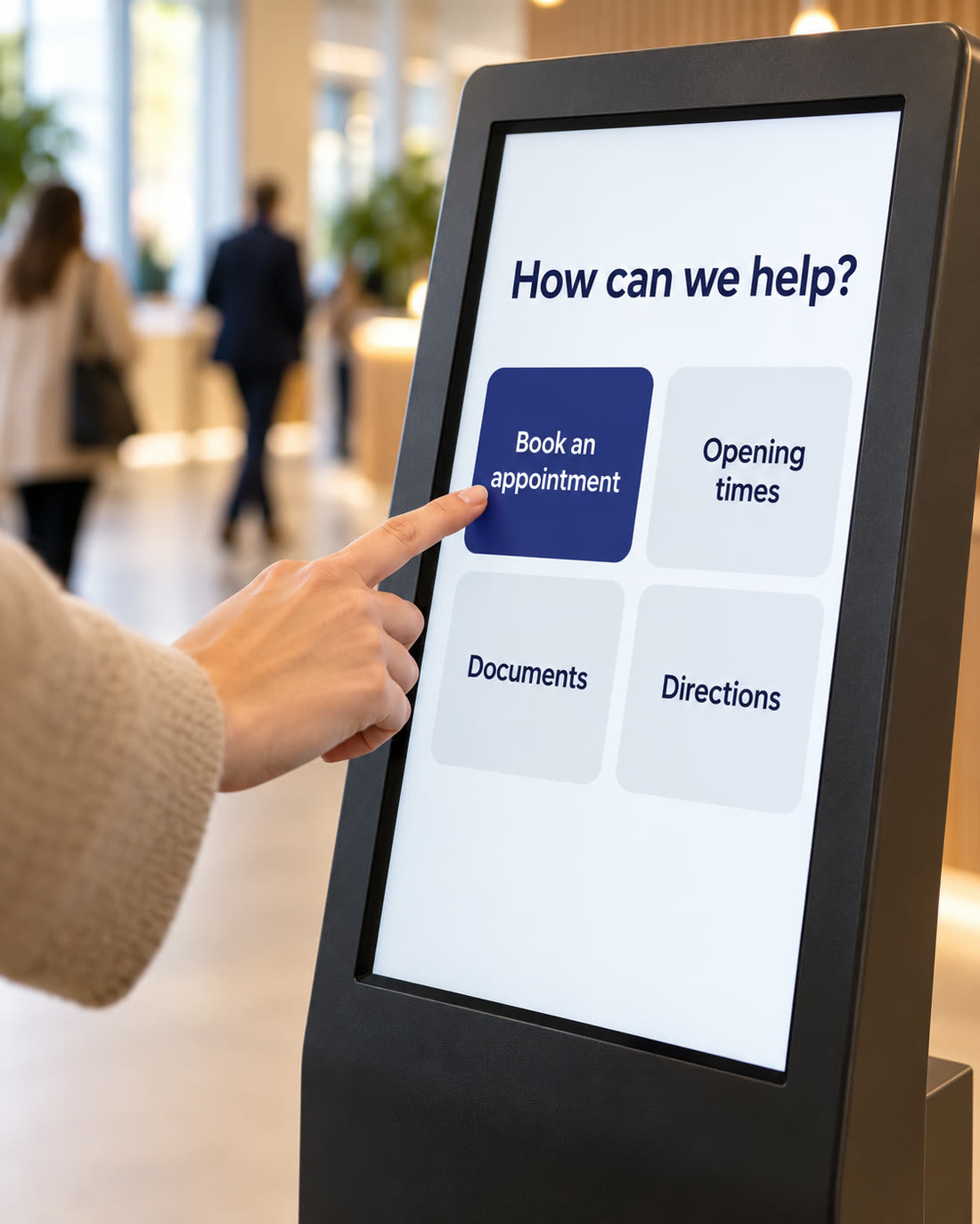 A visitor tapping Book an appointment on a touch kiosk